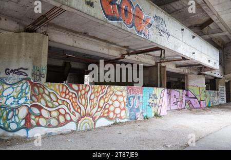 Graffiti painted along the former Sniper Tower in western Mostar, Bosnia and Herzegovina Stock Photo