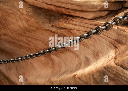 Eroded Rock From Years Of Metal Chain Swinging In The Wind along the Angels Landing Trail Stock Photo