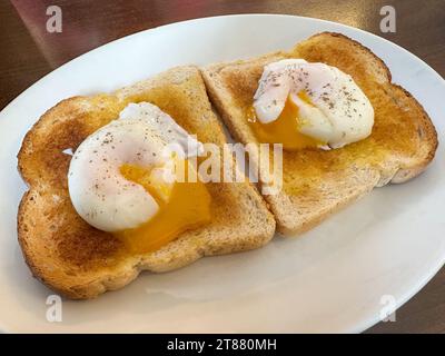 Two poached eggs on toast Stock Photo