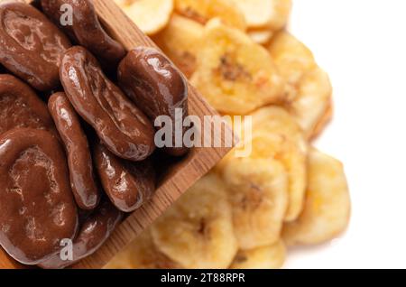 Sweet Chocolate Covered Banana Chips and Original Banana Chips Isolated on a White Background Stock Photo