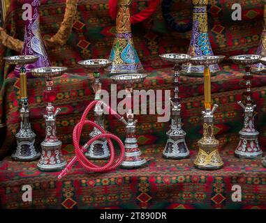 Group of eastern hookahs placed of various colors on a shelf Stock Photo