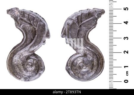 Ancient malaysian tin coin in the shape of a seahorse. Isolated on white Stock Photo