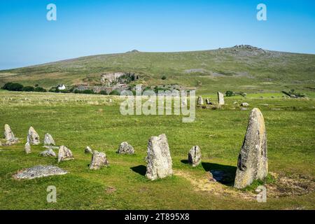 A stone row, one of several Bronze Age monuments around Merrivale on Dartmoor, near Tavistock, Devon, with Great Staple Tor in the background. Stock Photo