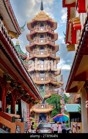 Chee Chin Khor temple by the Chao Phraya River in Bangkok, Thailand, belonging to a philanthropic society, its multi-storied pagoda in the b/g Stock Photo