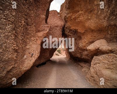 Driving through large stones at the bottom of the Valley of Castles. Charyn Canyon National Park. A small replica of the US Grand Canyon Stock Photo