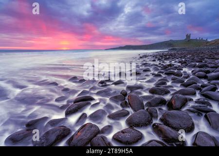 Dunstanburgh Castle beach Stock Photo
