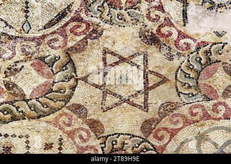 Antique mosaic depicting the star of David on the floor of the house of Dionysus. Paphos Archaeological Park. Cyprus. Stock Photo