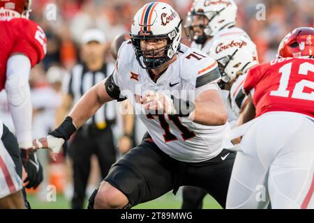 Oklahoma State offensive lineman Dalton Cooper 71 looks to block