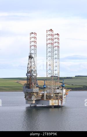 An oil platform is pictured moored off Invergordon.  Invergordon is a town in Ross and Cromarty known for the repair of oil rigs. Stock Photo