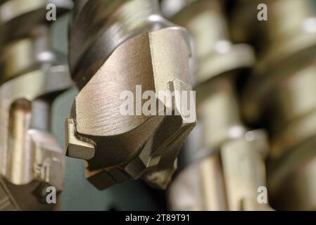 Set of hammer drill bits, industrial construction tools, close-up shot, shallow depth of field Stock Photo