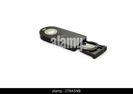 Wireless remote control for DSLR camera with battery removed. Isolated on white background Stock Photo