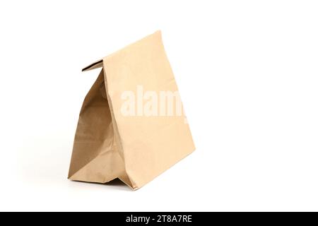 Close and full paper disposable bag of brown kraft paper isolated on white background, concept of rejection of plastic packaging. Mockup for design Stock Photo