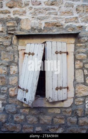 Broken old window in Budva, Montenegro Stock Photo