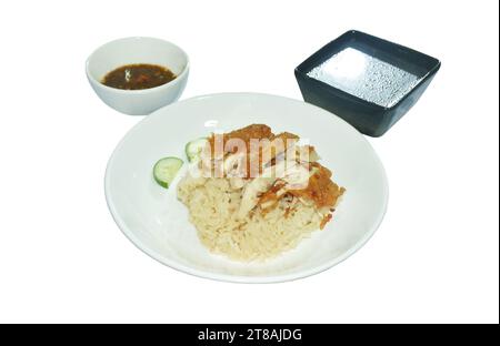 steamed rice topping chop crispy fried  chicken on plate with chili sauce and soup Stock Photo