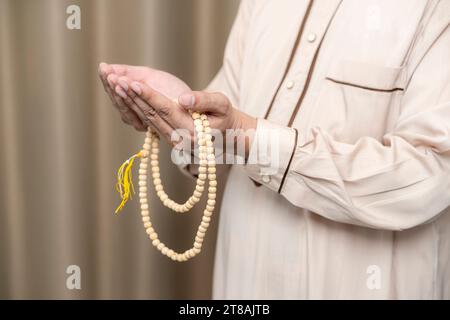 Muslim man reading holy Quran. Islamic concept. Stock Photo