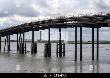 Abandoned Jetty - Occidental Oil Refinery Jetty, Canvey Island, Holehaven creek and Coryton Refinery site background. Post Industrial Landscape. Stock Photo