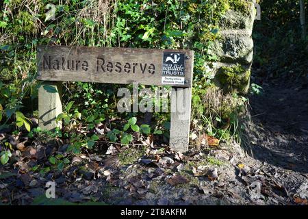 A wooden sign for The Derbyshire Wildlife Trust Nature Reserve on The Cromford Canal. Cromford, Derbyshire, UK, November 17, 2023. Stock Photo