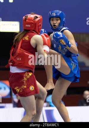 Houston, USA. 18th Nov, 2023. Liang Xuezhen (L) of China's Macao competes against Jenifer Kilapio of the Phillipines during the women's 48kg Sanda quarterfinal at 16th World Wushu Championships (WWC) in Fort Worth, Texas, the United States, on Nov. 18, 2023. Credit: Tian Dan/Xinhua/Alamy Live News Stock Photo