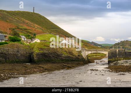 The Afon Ystwyth flowing out to sea with the Pen Dinas Hill Fort in the distance, Abeystwyth, North Wales Stock Photo