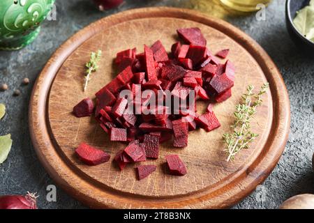 Sliced red beet on a wooden cutting board - preparation of fermented beet kvass Stock Photo