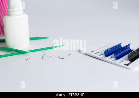 Artificial eyelashes in black and blue on a white background Stock Photo