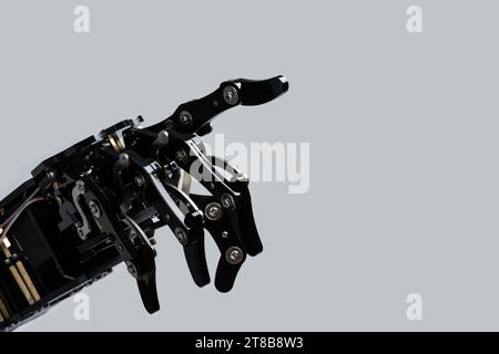 Real robot's hand pointing or pushing on something. Concepts of AI development and robotic process automation Stock Photo