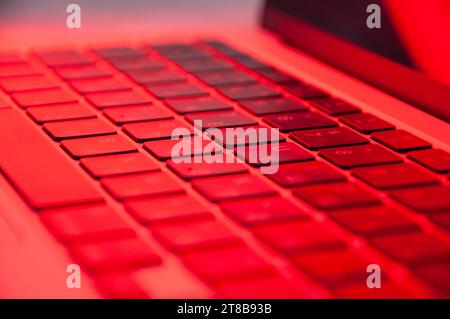 laptop keyboard close up with RGB lighting, side view Stock Photo