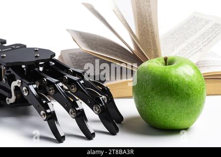 Real robotic hand and opened book. Concept of AI power and machine learning Stock Photo