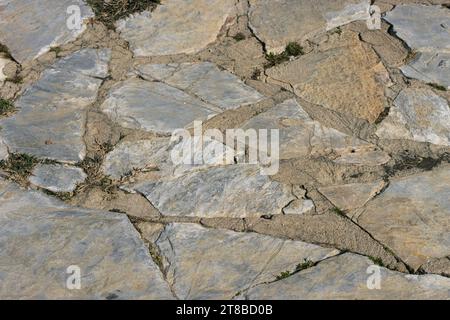 path in the yard made by hand from stones of various shapes.close up Stock Photo