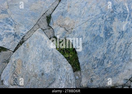 path in the yard made by hand from stones of various shapes.close up Stock Photo