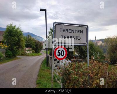 Name board of the village of Terenten (Italian: Terento) in the Alps of South-Tyrol, Italy. Speed limit of 50 is also indicated. Stock Photo