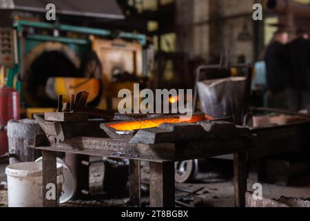 Mold with molten metal in the foundry workshop of metallurgical plant Stock Photo