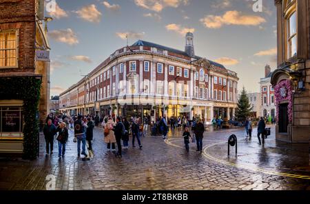 ST HELENS SQUARE, YORK, UK - NOVEMBER 17, 2023. Shoppers and crowds of people in York city centre at Christmas with Betty's Cafe and Tea Rooms building Stock Photo