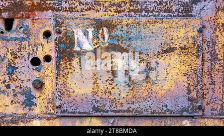 Industrial grunge rusty metal background texture with faded yellow and red paint Stock Photo