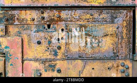 Industrial grunge rusty metal background texture with faded yellow and red paint Stock Photo