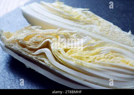 sliced napa cabbage on the stone board. Fresh veggies texture Stock Photo