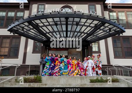 Members of the youth folkloric dance group Joyas Mestizas pose for a photo at El Centro de la Raza during the annual Día de los Muertos celebration in Stock Photo