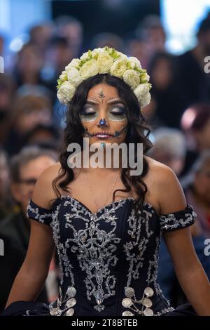 A young woman participates in a Catrina fashion show at El Centro de la Raza’s annual Día de los Muertos celebration in Seattle on Saturday, November Stock Photo