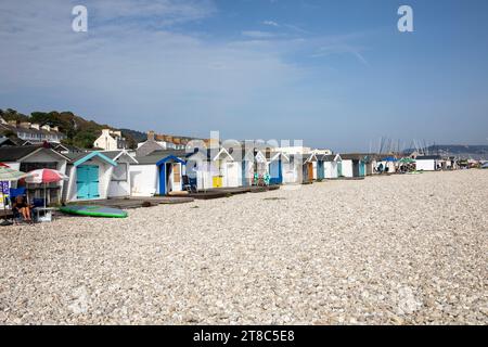 Lyme Regis Dorset England, colourful beach huts on shingle pebble Monmouth Beach,English coastline,UK,2023 Stock Photo