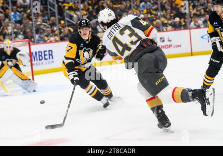 Pittsburgh, United States. 19th Nov, 2023. Vegas Golden Knights center Paul Cotter (43) takes a shoots pass Pittsburgh Penguins defenseman Ryan Graves (27) towards Pittsburgh Penguins goaltender Alex Nedeljkovic (39) during the first period at PPG Paints Arena in Pittsburgh on Sunday, November 19, 2023. Photo by Archie Carpenter/UPI. Credit: UPI/Alamy Live News Stock Photo