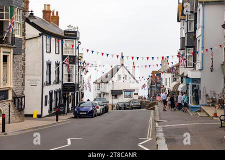 Lyme Regis town centre shops on Broad street and Royal Lion public house,Dorset,England,UK Stock Photo