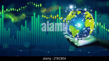 Businessman holding globe over the stock market financial data. Copy space. World Financial Concept. Stock Photo