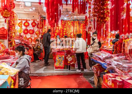 SHEN ZHEN,CHINA - January 13,2023: People buying Tradition decoration of Chinese and good luck symbols for Chinese New Year in Shenzhen Flower Market Stock Photo