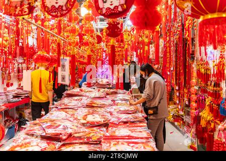 SHEN ZHEN,CHINA - January 13,2023: People buying Tradition decoration of Chinese and good luck symbols for Chinese New Year in Shenzhen Flower Market Stock Photo