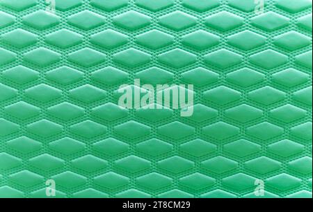 green leather background and texture as a pattern for the interior car or a sofa or wall covering Stock Photo