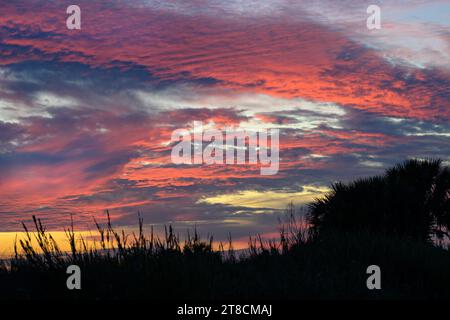 Sunset sky over Texas wetlands along the Gulf of Mexico, with altocumulus and cirrocumulus clouds Galveston, Texas, USA. Stock Photo