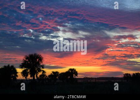 Sunset sky over Texas wetlands along the Gulf of Mexico, with altocumulus and cirrocumulus clouds Galveston, Texas, USA. Stock Photo