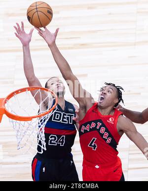 Toronto, Canada. 19th Nov, 2023. Scottie Barnes (R) of Toronto Raptors fights for a rebound with Kevin Knox II of Detroit Pistons during the 2023-2024 NBA game between Toronto Raptors and Detroit Pistons in Toronto, Canada, on Nov. 19, 2023. Credit: Zou Zheng/Xinhua/Alamy Live News Stock Photo