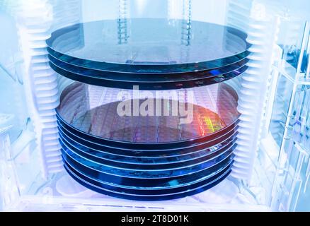 Silicon Wafer Under Cleanroom Fabrication in plastic holder box Stock Photo