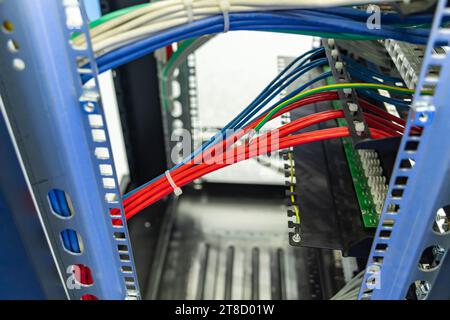 Network cables in switch and firewall in cloud computing data center server rack Stock Photo